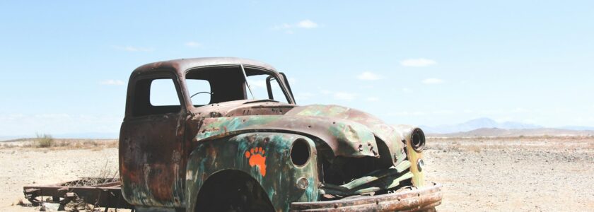 wrecked single cab pickup truck on field