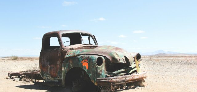 wrecked single cab pickup truck on field